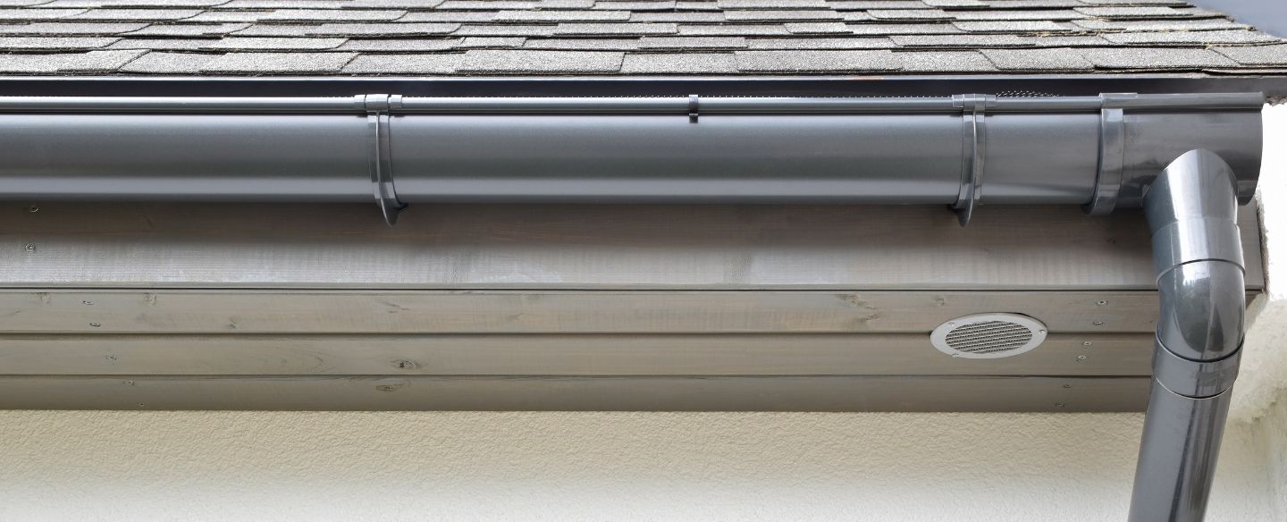 grey plastic rain gutter with drain downspout pipe yorktown heights ny
